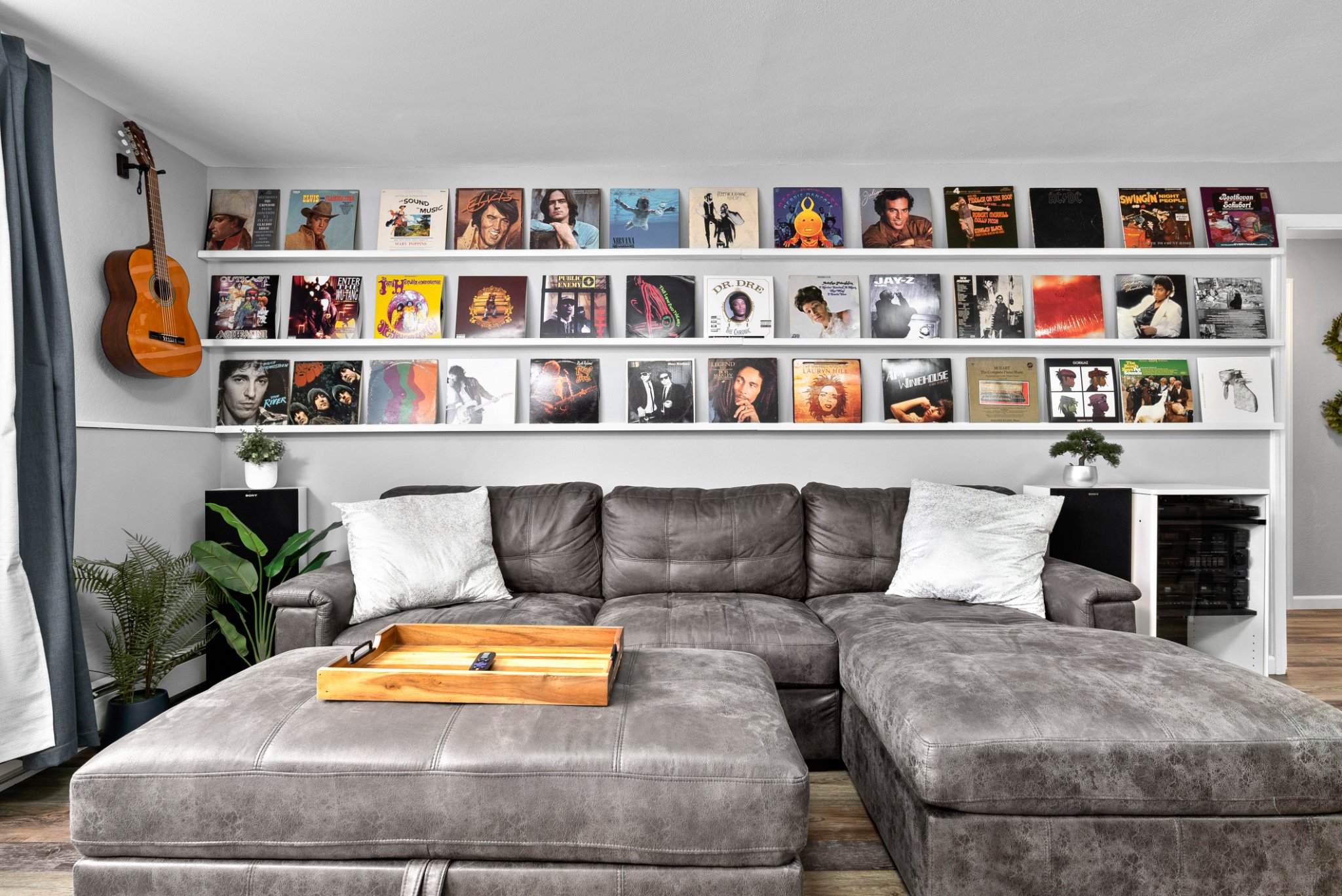 Living area of uniquely decorated Air BnB unit. Vinyl albums and musical instruments create an appealing visual theme.