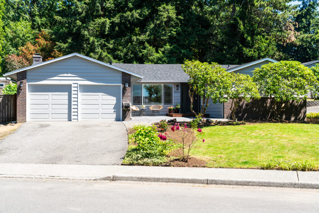 Exterior image of a 3BR rambler home in a typical suburban middle class neighborhood.