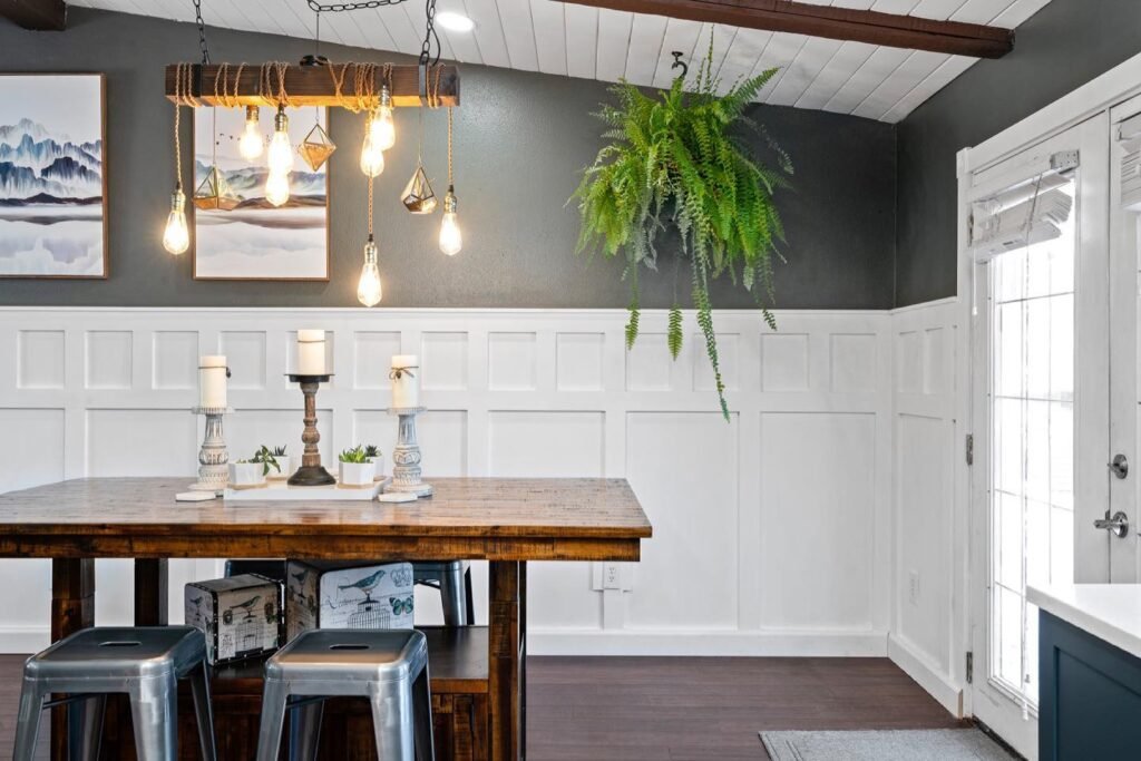 Inviting dining area with a wooden table, metal seating, and attractive lighting, perfect for family meals or entertaining in this well-appointed home or rental property.